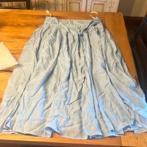 NWT. Blue float skirt. Tie front. Slits on side. Comfy and cute